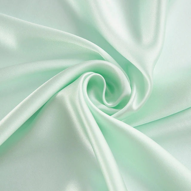 Mint green fabric with a smooth texture