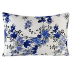 Floral patterned pillow with blue flowers on a white background