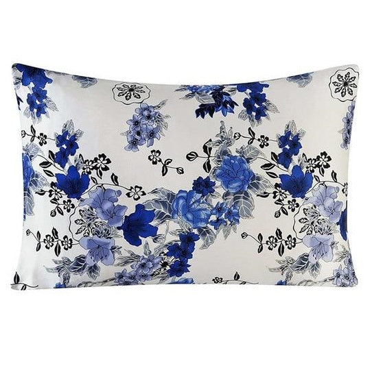 Floral patterned pillow with blue flowers on a white background