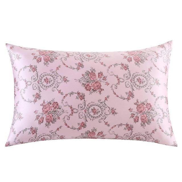 Pink pillowcase with floral paisley pattern on a white background