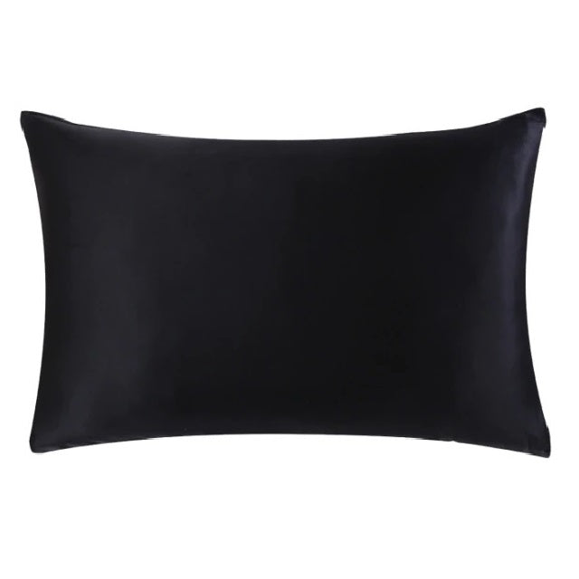 Black satin pillow on a white background