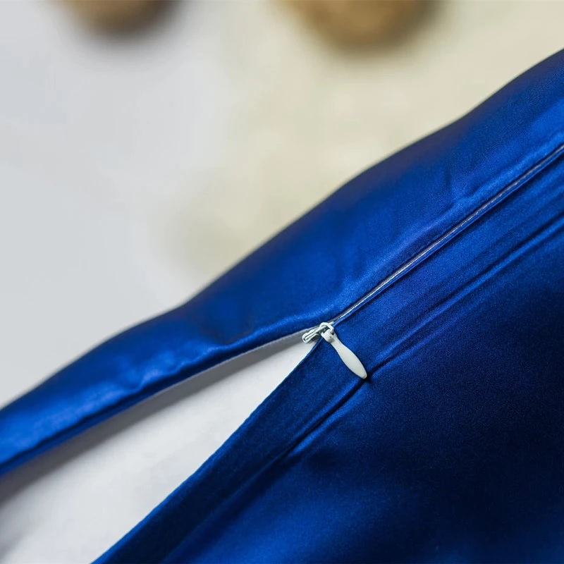 Close-up of a blue fabric with a zipper on a light background