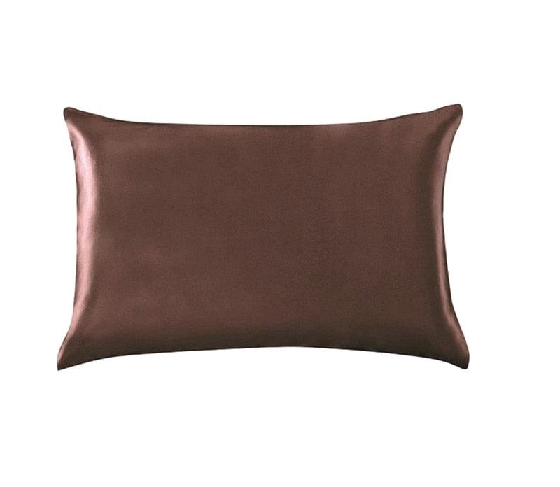 Brown satin pillow on a white background