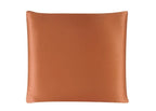 Brown leather pillow on a white background
