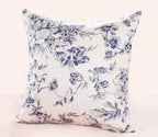 Floral-patterned pillow with blue flowers on a white background