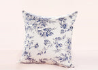 Floral-patterned pillow on a light pink background