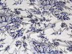 Blue floral pattern on white fabric