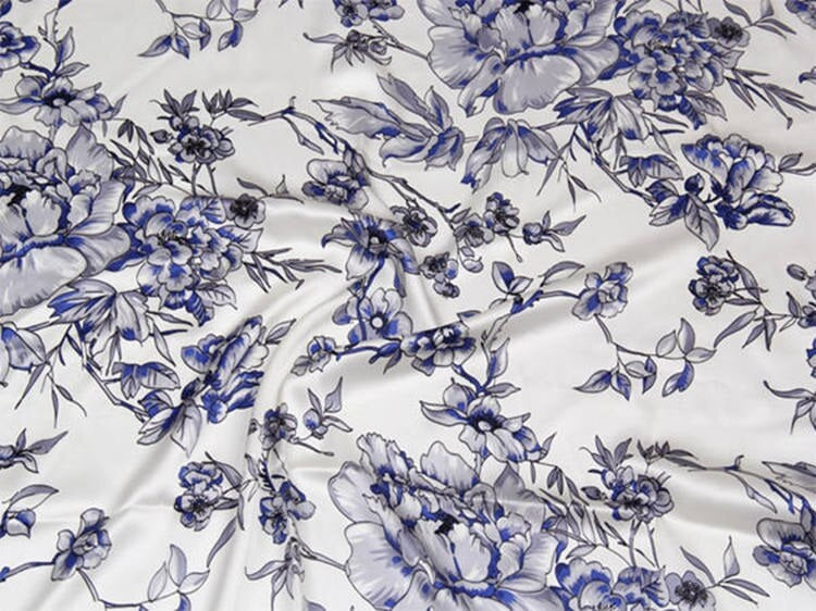Blue floral pattern on white fabric