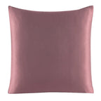 Pink satin pillow on a white background