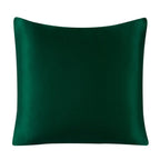 Green satin pillow on a white background