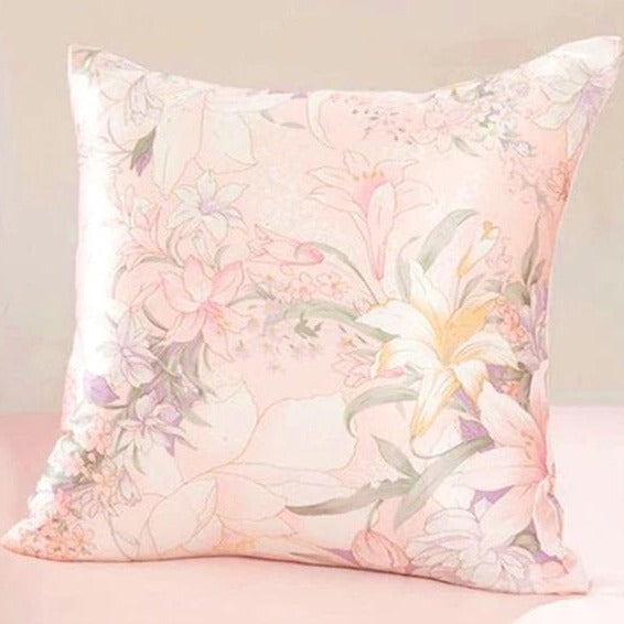 Floral patterned pillow on a light pink background