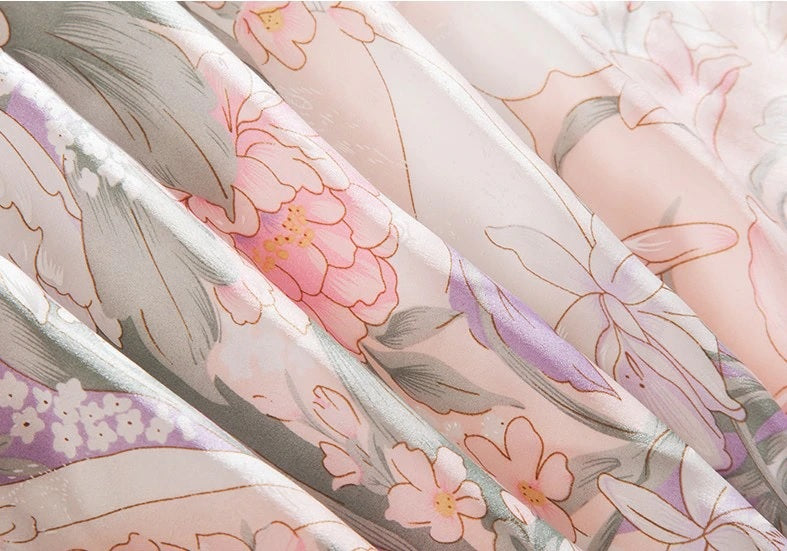 Sheer fabric with floral and butterfly pattern in soft colors