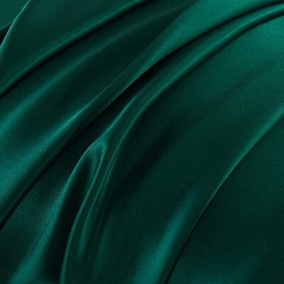 Close-up of dark teal fabric with folds