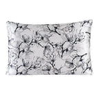Floral patterned pillowcase with black and gray flowers on a white background
