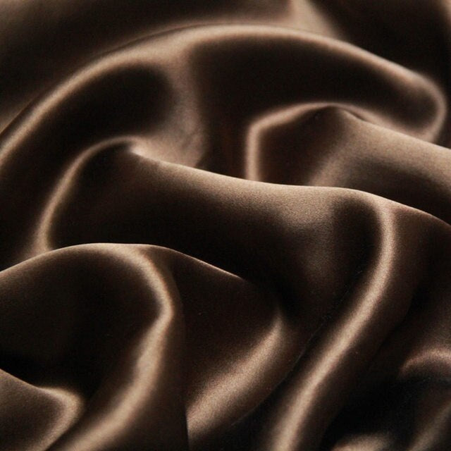 Close-up of brown fabric with folds