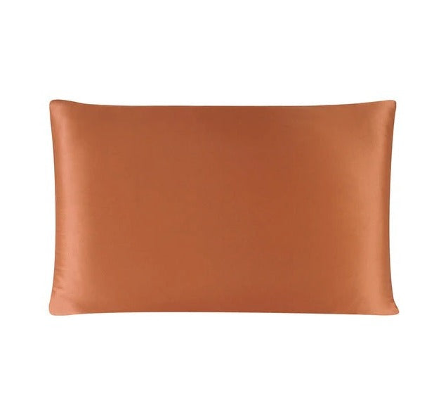 Brown satin pillowcase on a white background