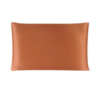 Brown satin pillowcase on a white background