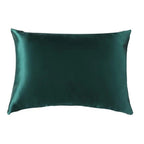 Green satin pillowcase on a white background