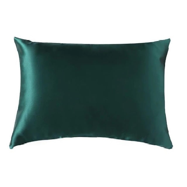 Green satin pillowcase on a white background