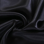 Close-up of dark blue fabric with folds