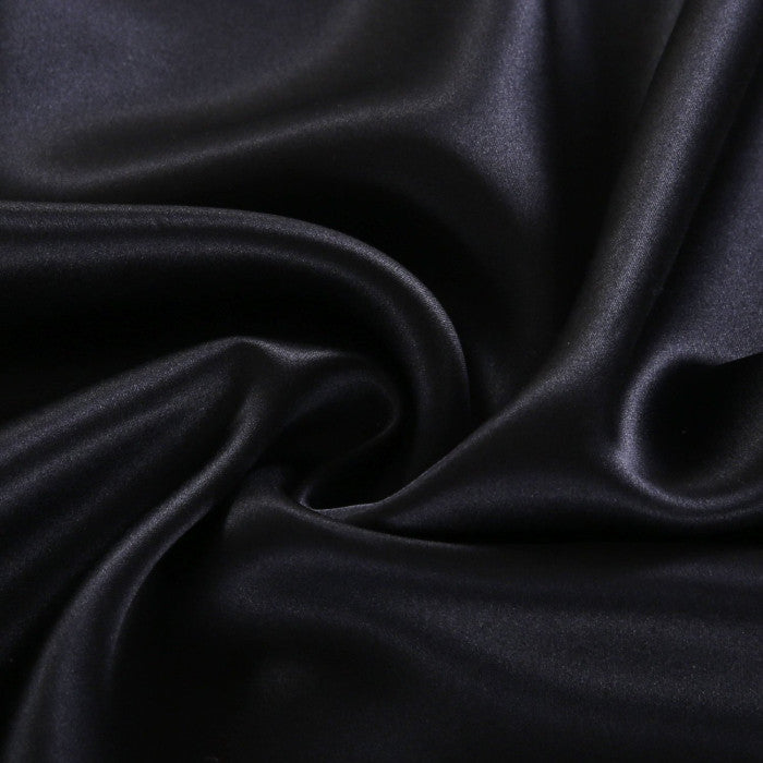 Close-up of dark blue fabric with folds