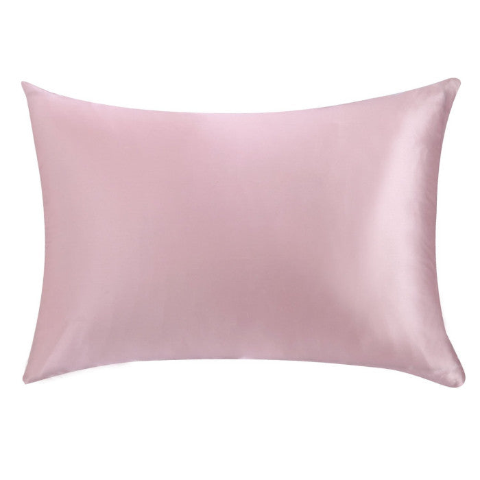 Pink satin pillowcase on a white background