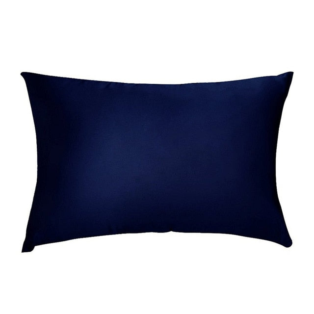 Navy blue pillow on a white background